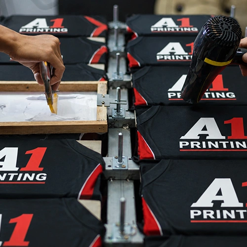 Close-up of custom logo screen printed on cotton t-shirt