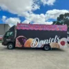 Truck signage Melbourne with large-scale branding graphics on a commercial transport vehicle