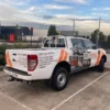 Tradie ute with full wrap signage Melbourne showing plumbing business branding and contact details